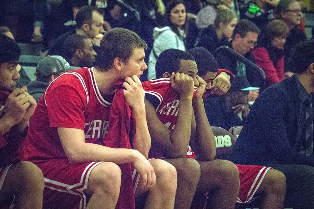 As it became clear the Hawks would run out of time for a come-back, senior posts Loren LaCasse (left) and Yoel Tekle watch from the Mountlake Terrace bench. The Wilson Rams defeated the Hawks 58-38 at Mount Tahoma High School.