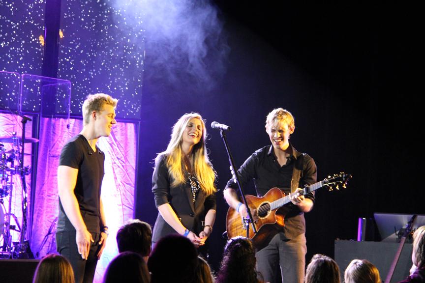 From Left: Dalten Nelson, Riana Nelson and Derik Nelson perform as a trio on stage. 