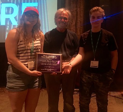 Editor in Chief Paxtyn Merten and HBN Producer Sky Schank accept the FAPFA plaque from JEA Press Rights Commission Chair John Bowen at the opening ceremonies of the JEA/NSPA Convention Thursday, April 14 in Los Angeles.