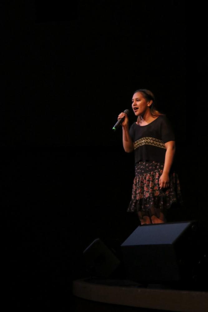 Abigail Apana, MTHS junior, sings __ 