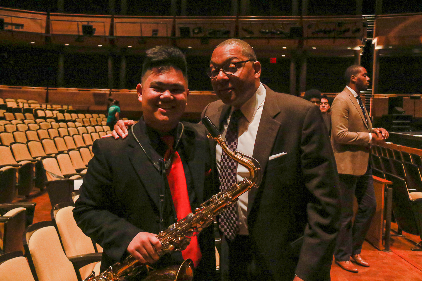 Senior Andrew Sumabat meets with Wynton Marsalis after Terraces performance in Rose Theater. Sumabat briefly discussed his solos with Marsalis before the shot was taken.