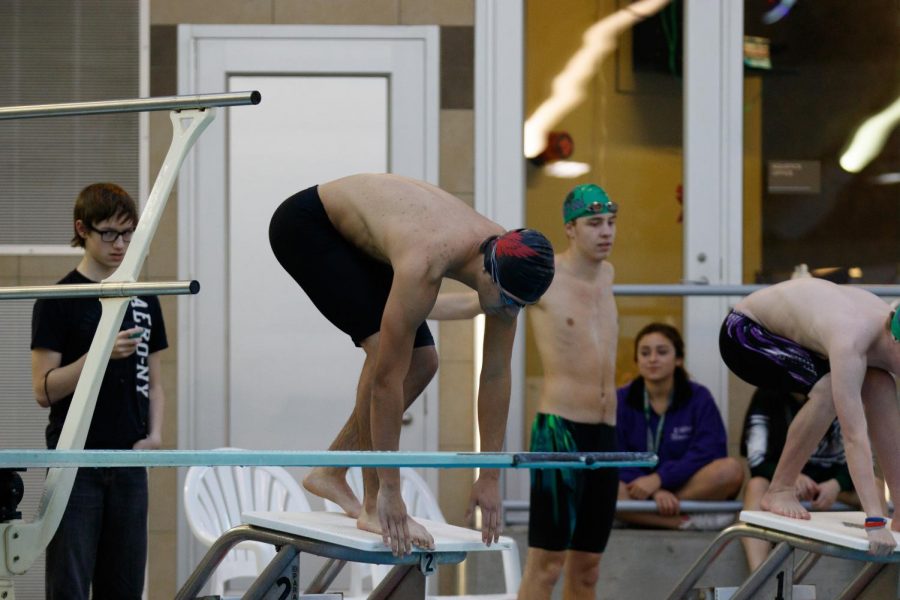 Senior+Ryan+Figueroa+takes+his+mark+before+swimming+freestyle+stroke+at+a+meet.+Throughout+high+school%2C+he+participated+on+the+swim+team+for+two+years.