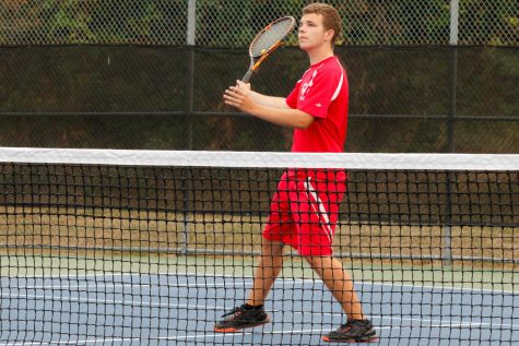 Senior Jake Peters keeps his eye on the ball at tennis practice on the MTHS tennis courts.