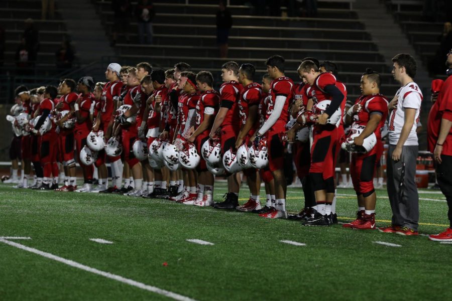 The Hawks football team focus their attention to pre-game routines before their match against the Mercer Island Islanders on Aug. 31. This season opener with a 28-6 loss for the Hawks, who are starting their first year in the 2A Northwest Conference Lake Division.