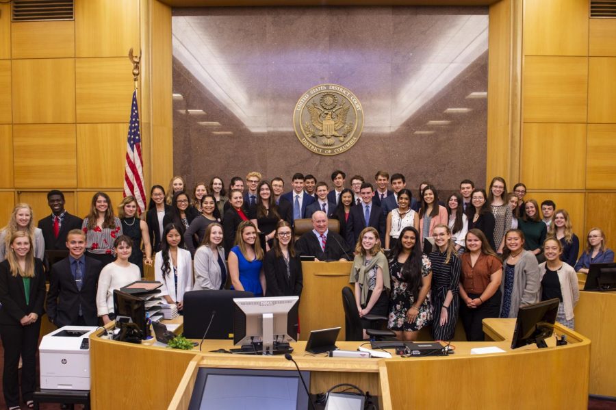 The Free Spirit scholars pose with Senior U.S. District Court Judge Royce C. Lamberth inside of the U.S. District Court. Lamberth led the Free Spirits in a mock trial that examined the rights to freedom of expression held by students. 