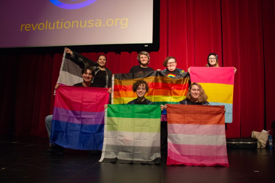 MTHS GSA presenters pose with the pride flags.