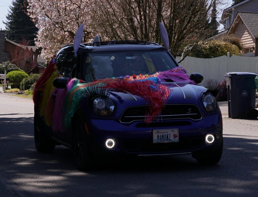 The Easter Bunny is driven through local neighborhoods by Brier Park Board volunteers during the parade on the day before Easter. He waved to excited families and their children who gathered in their front yards to participate in the festivities. 