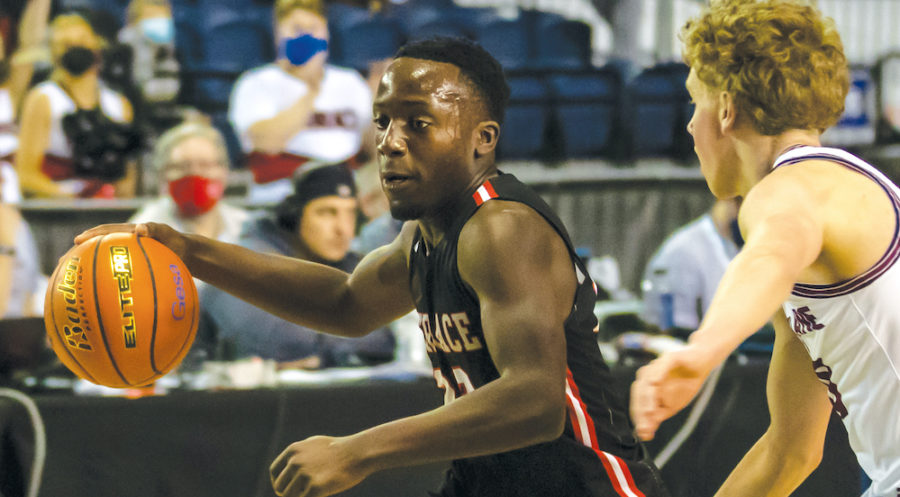 Senior guard Jeffrey Anyimah drives against Mt. Spokane in the Tacoma Dome. The Hawks finished in 6th place.