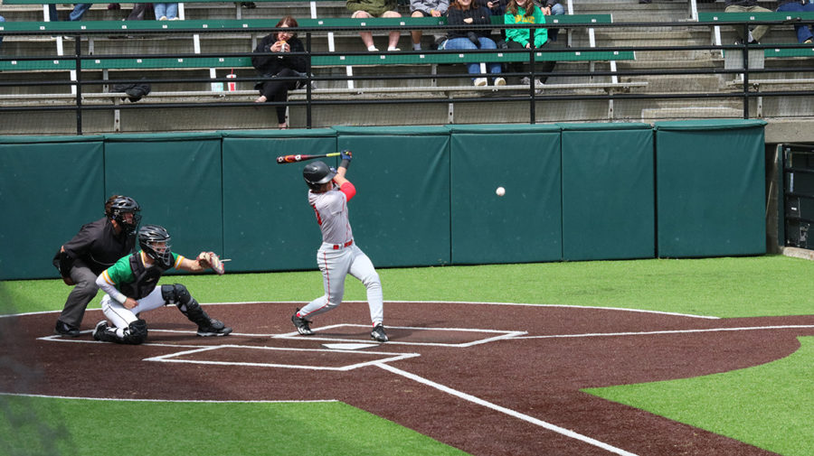 Sophomore shortstop Talan Zenk blasts a Blanchet pitch in the May 17 opening round state tourney game.