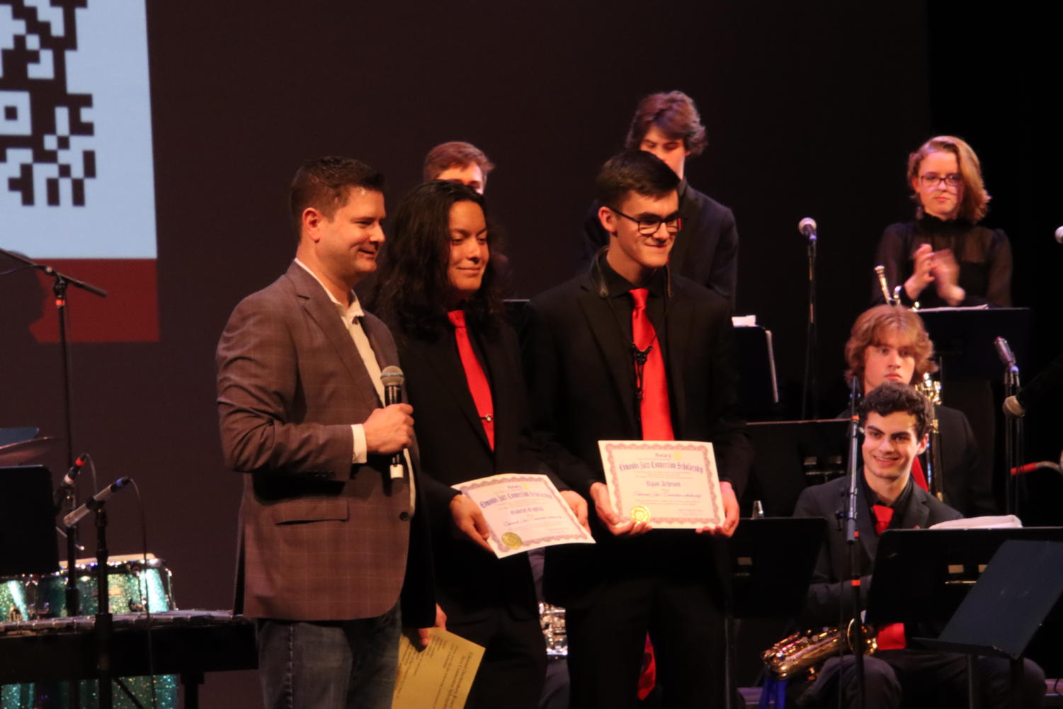 Gabriel Espitia and Ryan Acheson receiving their scholarship on stage 