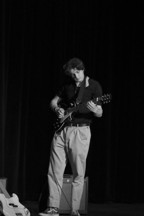 Senior Nathaniel Ballard performing a song with band American Cheddar at round one of Terrace Got Talent.
