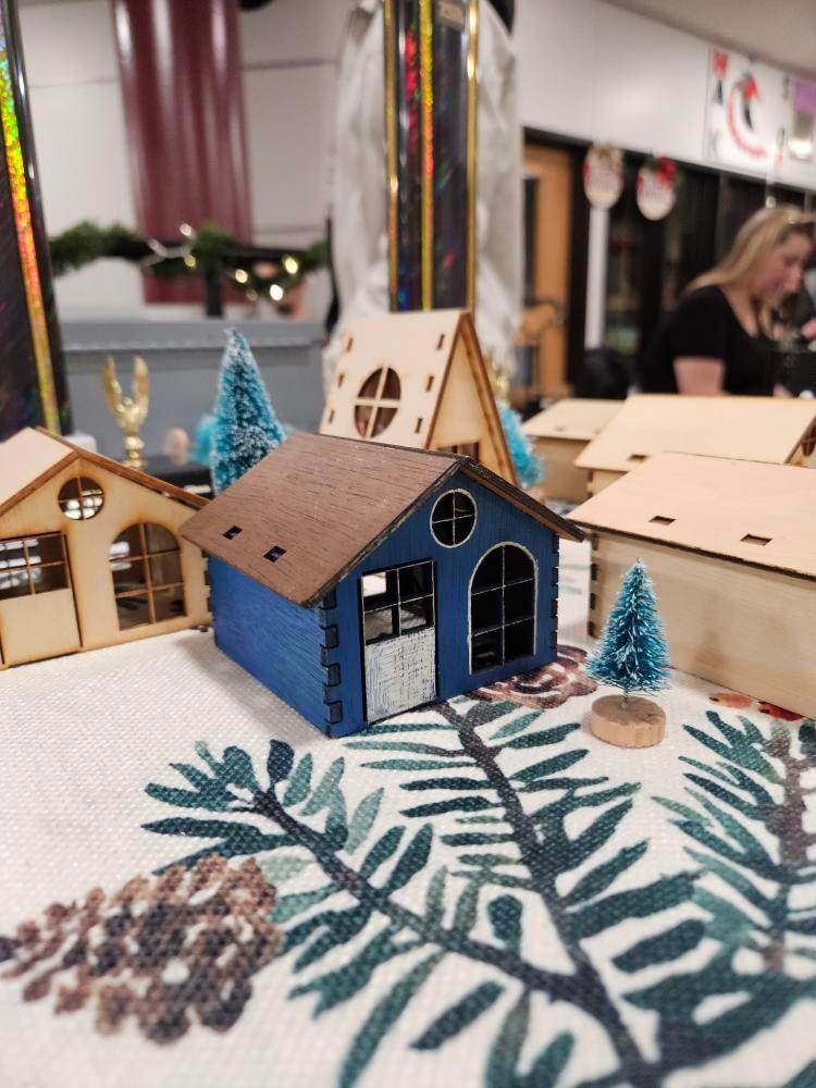 STEM Bazaar Holiday offerings, wood ornament and holiday miniature homes, among other crafts.