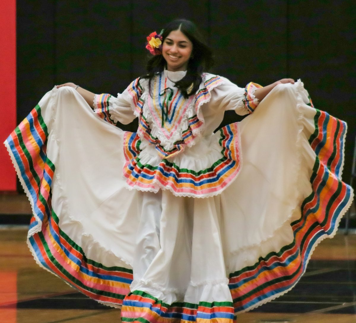 Yaretzi Ramirez Olivera displays a colorful Mexican huipil dress during the fashion show