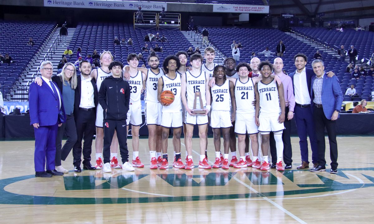 The Hawks gather for a team photo following their 65-54 victory over Garfield to earn 4th place at the 3A WIAA state championships at the Tacoma Dome.
