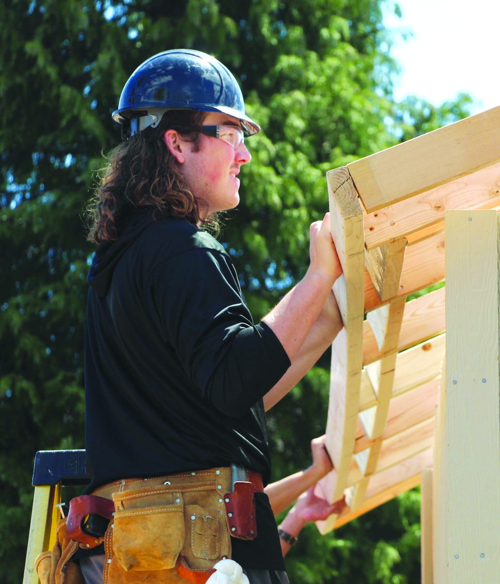 🏆 Seras Top Photo: May🏆 Cody Snow works to build small homes as part of the carpentry program.