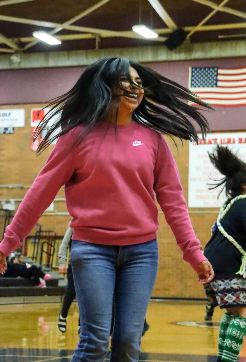 Senior Yaretzi Ramirez joining as an audience volunteer with the Lummi Nation School Blackhawks in a dance during an optional assembly held on May 30. The assembly was organized for students to learn more about Native American culture — the Lummi Nation’s practices in specific. 