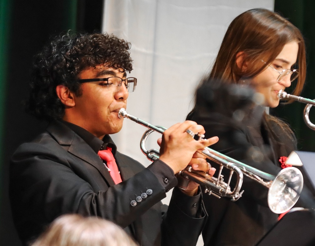 Senior Jesse Guasch (pictured to the left of fellow Senior Sophia Pigott), plays part in the trumpet section during the Jazz Band’s performance at the Hot Java, Cool Jazz festival. 