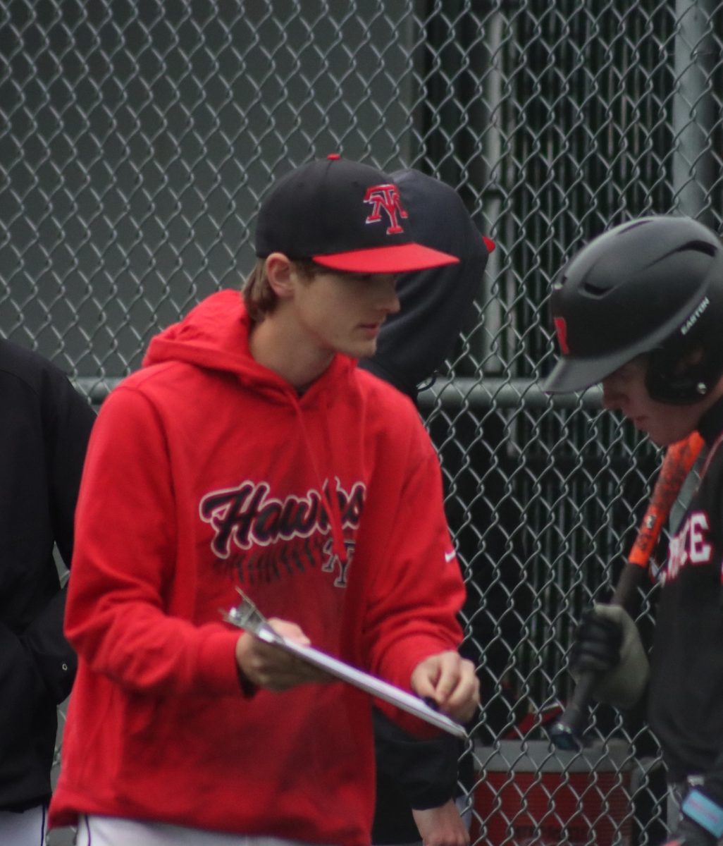 Ryan Sturgill explains to teammate Matthew Meadows the tendancy of the opposing pitcher so he would know how go about his next turn up to bat. 