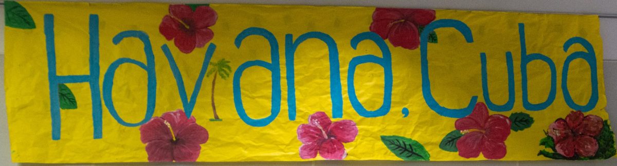 The junior class designs a sign for their theme of Havana, Cuba.