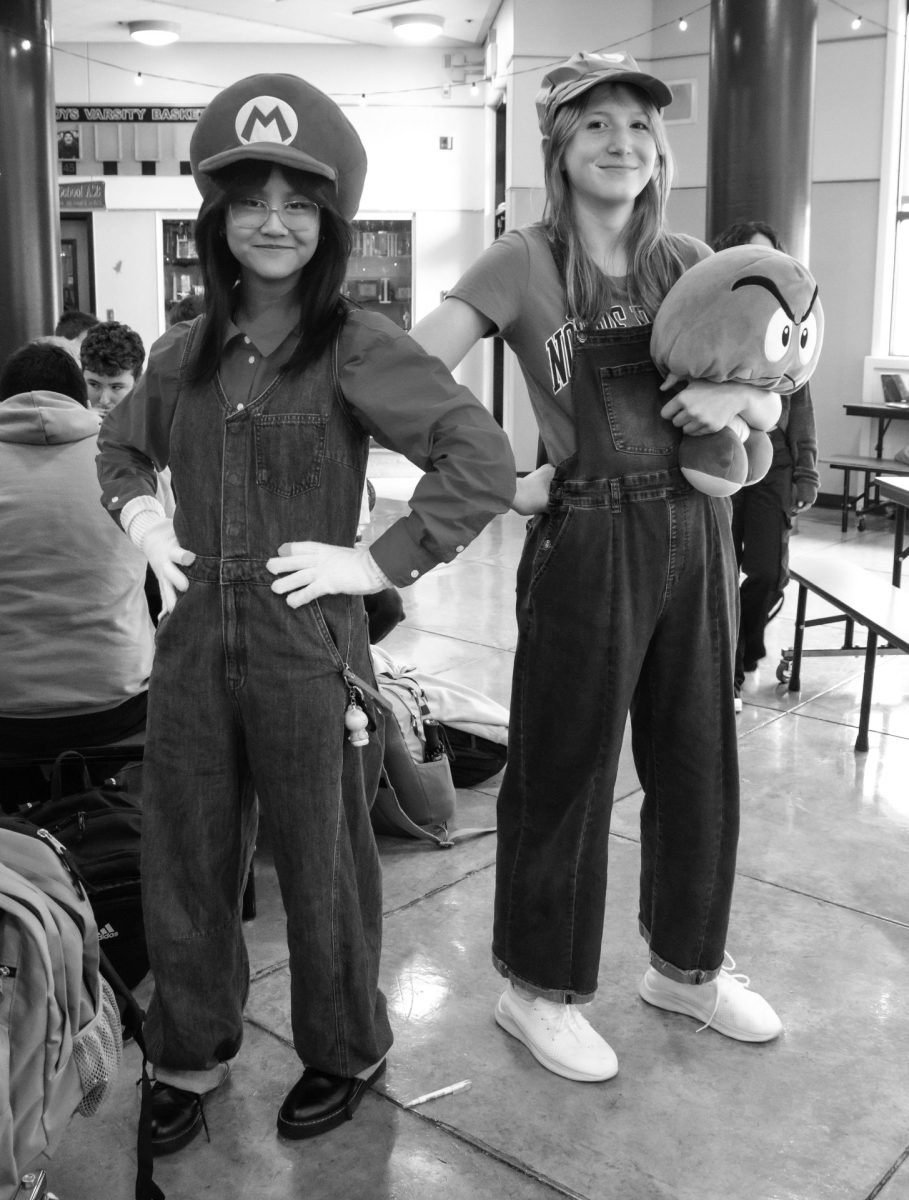 Freshmen Reina Mensalvas and Daphne McDowell pose as Mario and Luigi with a Toad plush for Wednesday’s Character Spirit Day