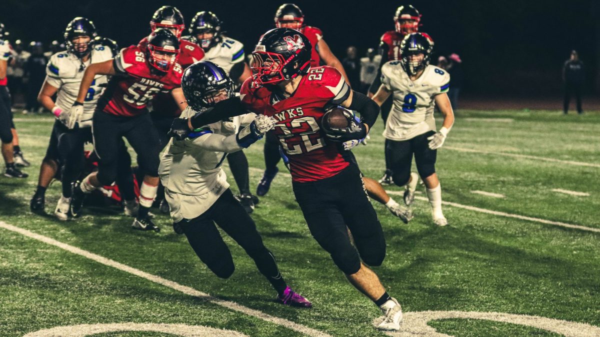 Sophomore Owen Boswell sprints ahead of Shorewood’s defense in his multi-touchdown game, earning the name ‘cyborg’ given to him by his teammates. Boswell rushed for nearly 150 yards in the game.