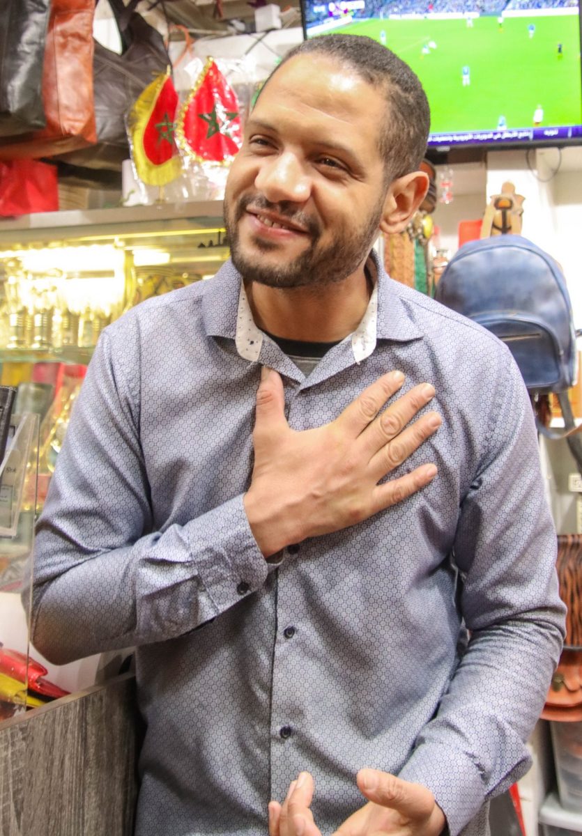 Chakir Bouchaib, owner of Little Marrakesh Bazaar, welcomes guests in and invites them to look at his products.