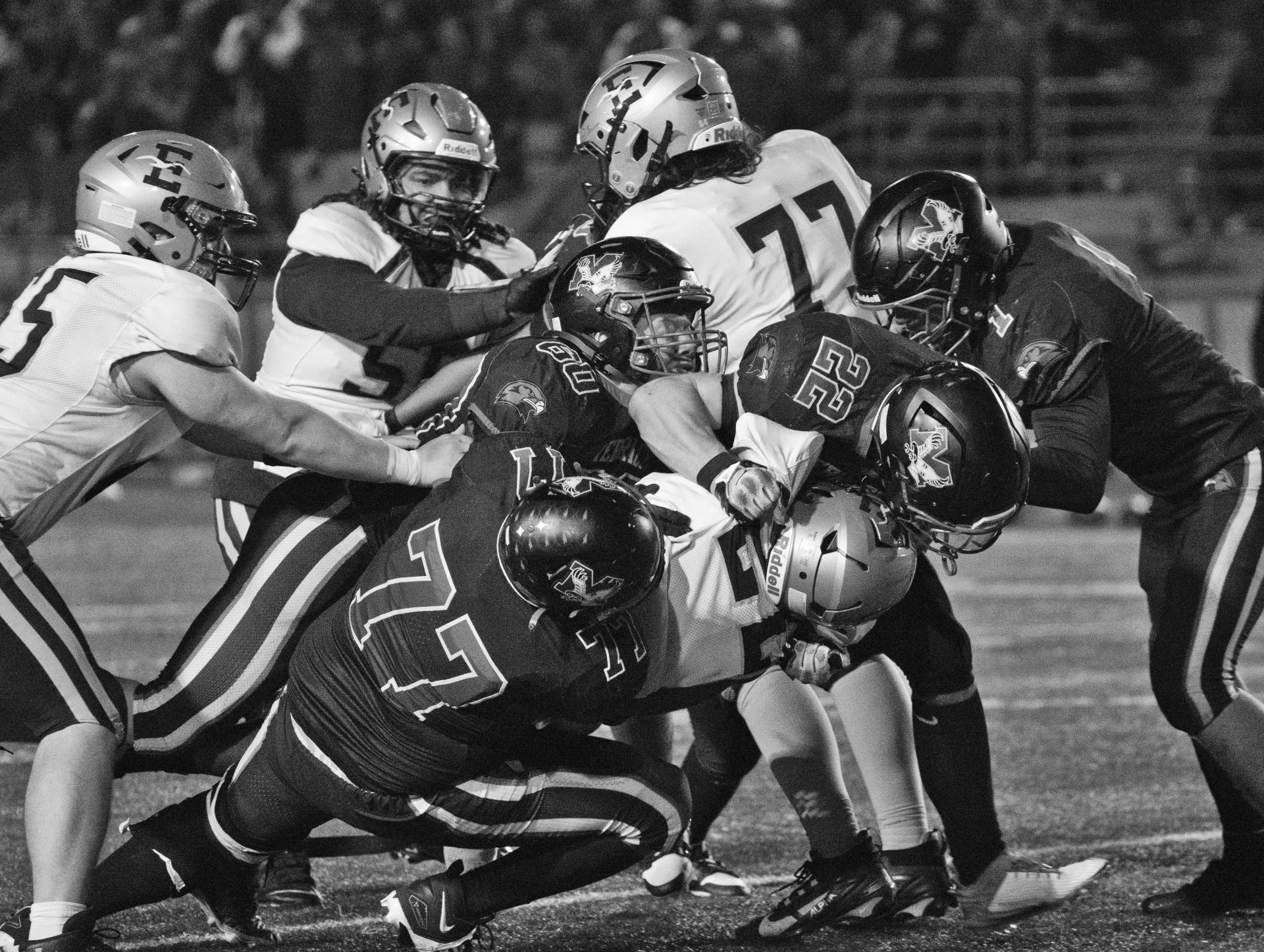 Terrace players work together to take down an opposing player from Everett.