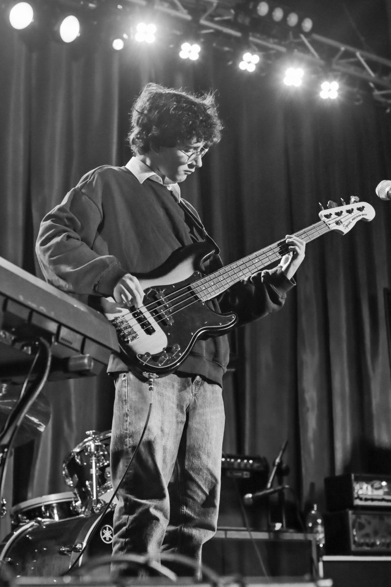 Junior Jason Perkins from “Kidney Failure” playing the bass guitar to The Killers’ “Brightside.”