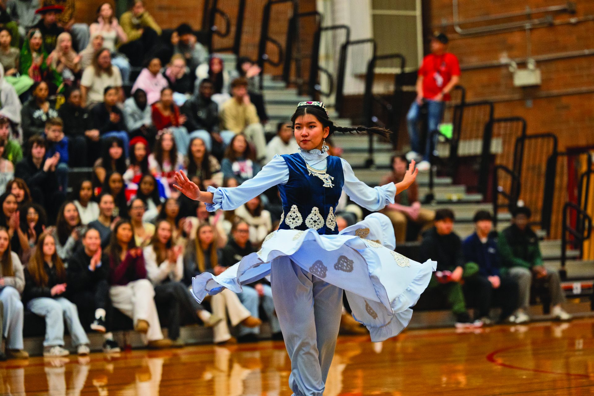  Madina Aburashidova preforms a traditional Chamanda Gul dance, a piece of culture from her native country Uzbekistan. Many students preformed dances and other cultural showcases at the multicultural assembly.
