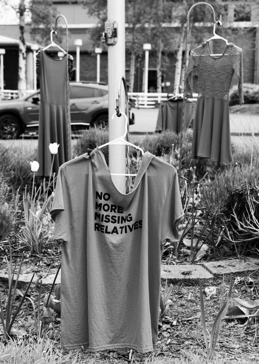 Several articles of clothing outside the front of the school bring awareness to MMIP, one shirt reading “no more missing relatives.”