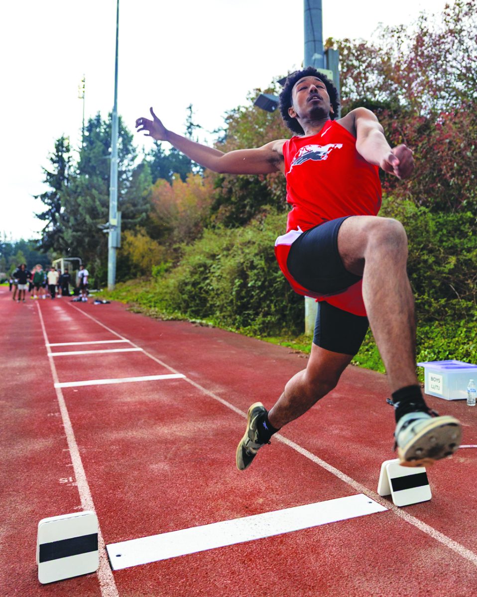 Terrace senior Adam Esayas leaps to a distance of 16 foot 10 inches in the mens long jump during the second WESCO meet of the season at Edmonds Stadium, April 2, 2026.